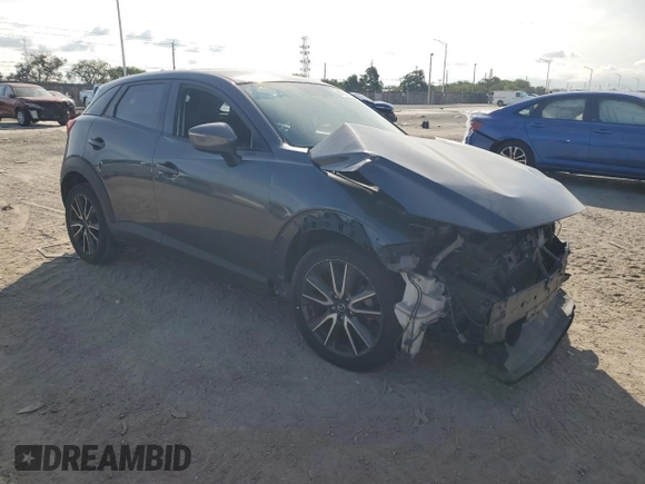 2017 Mazda CX-3 Touring z VIN JM1DKDC77H0151148, wystawiony jako Copart lot #81897434 z przebiegiem Nie podano mil oraz Szkoda całkowita • Salvage title. Historia ofert i sprzedaży dostępna na DreamBid. Obrazek 4.