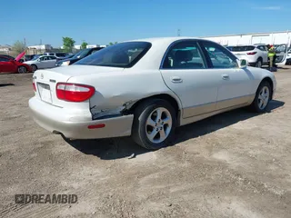 2001 Mazda Millenia z VIN JM1TA221111714677, wystawiony jako IAAI lot #42203182 z przebiegiem 130 847 mil mil oraz . Historia ofert i sprzedaży dostępna na DreamBid. Obrazek 4.