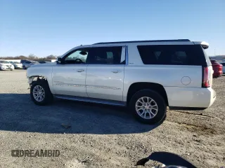 2015 GMC Yukon XL SLT with VIN 1GKS1HKC2FR130964, listed as a Copart auction lot 87796695 with 173,020 mi miles and Salvage Title. Bid and sale history available at carsss.com. Image 2.