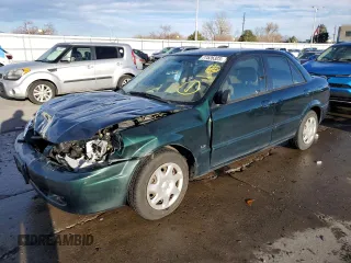 1999 Mazda Protege DX with VIN JM1BJ2227X0102681, listed as a Copart auction lot 77526323 with 103,726 mi miles and Salvage Title. Bid and sale history available at DreamBid. Image 1.