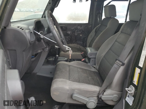 2007 Jeep Wrangler Unlimited X z VIN 1J4GA39197L181305, wystawiony jako Copart lot #45928555 z przebiegiem Nie podano mil oraz Szkoda całkowita • Salvage title. Historia ofert i sprzedaży dostępna na DreamBid. Obrazek 7.