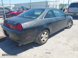 1999 Honda Accord Cpe EX with VIN 1HGCG2250XA012085, listed as a IAAI auction lot 42107661 with 266,736 mi miles. Bid and sale history available at carsss.com. Image 4.