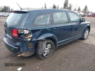 2014 Dodge Journey American Value Pkg with VIN 3C4PDCAB4ET149493, listed as a IAAI auction lot 41549858 with 117,905 mi miles. Bid and sale history available at carsss.com. Image 4.