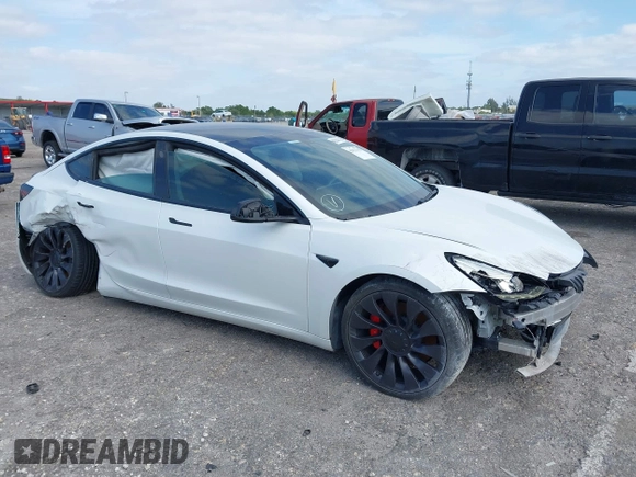 2021 Tesla Model 3 Performance z VIN 5YJ3E1EC5MF984891, wystawiony jako IAAI lot #42071151 z przebiegiem 72 883 mil mil oraz . Historia ofert i sprzedaży dostępna na DreamBid. Obrazek 1.