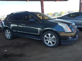 2014 Cadillac SRX Premium Collection z VIN 3GYFNDE31ES653114, wystawiony jako IAAI lot #42107858 z przebiegiem 125 192 mil mil oraz . Historia ofert i sprzedaży dostępna na DreamBid. Obrazek 1.