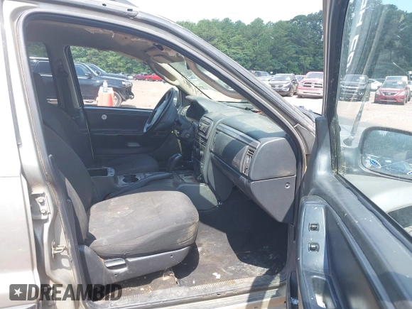 2004 Jeep Grand Cherokee Laredo with VIN 1J4GW48S34C354006, listed as a IAAI auction lot 42599812 with 258,004 mi miles and . Bid and sale history available at DreamBid. Image 5.