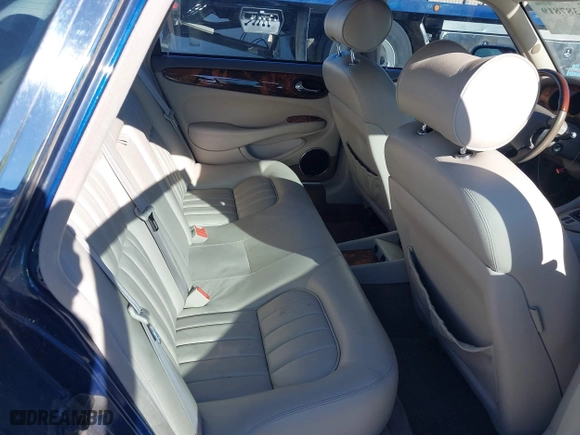 2000 Jaguar XJ with VIN SAJDA14C4YLF16529, listed as a IAAI auction lot 41387819 with 90,143 mi miles. Bid and sale history available at carsss.com. Image 8.