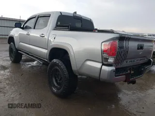 2018 Toyota Tacoma SR with VIN 5TFGZ5AN4JX142565, listed as a IAAI auction lot 41353718 with 87,544 mi miles and . Bid and sale history available at carsss.com. Image 3.