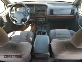 1998 Jeep Grand Cherokee Laredo with VIN 1J4GZ58S5WC165213, listed as a Copart auction lot 77611434 with 168,688 mi miles and Salvage Title. Bid and sale history available at carsss.com. Image 8.