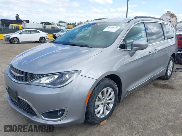 2017 Chrysler Pacifica Touring L with VIN 2C4RC1BG1HR803027, listed as a IAAI auction lot 41896775 with 112,896 mi miles and . Bid and sale history available at DreamBid. Image 2.