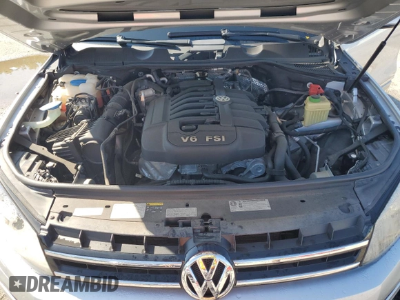 2014 Volkswagen Touareg Lux with VIN WVGEF9BP1ED012267, listed as a Copart auction lot 58924055 with 81,009 mi miles and Salvage title. Bid and sale history available at DreamBid. Image 12.