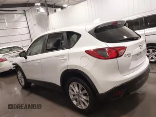2015 Mazda CX-5 Grand Touring with VIN JM3KE4DY4F0495627, listed as a IAAI auction lot 41887773 with 130,421 mi miles. Bid and sale history available at carsss.com. Image 15.