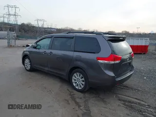 2014 Toyota Sienna LE with VIN 5TDJK3DC1ES087626, listed as a IAAI auction lot 41610813 with 142,311 mi miles and . Bid and sale history available at DreamBid. Image 3.
