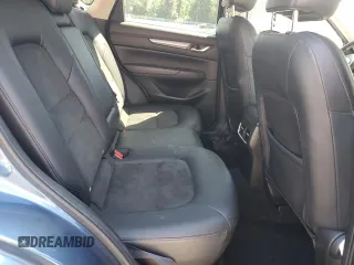 2018 Mazda CX-5 Touring z VIN JM3KFBCM2J1363310, wystawiony jako Copart lot #58969135 z przebiegiem 86 831 mil mil oraz Szkoda całkowita • Salvage title. Historia ofert i sprzedaży dostępna na DreamBid. Obrazek 11.