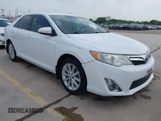 2014 Toyota Camry SE with VIN 4T1BK1FK5EU551196, listed as a IAAI auction lot 41912297 with 104,445 mi miles. Bid and sale history available at carsss.com. Image 1.