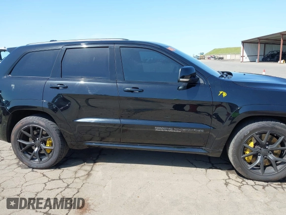 2020 Jeep Grand Cherokee Trackhawk with VIN 1C4RJFN96LC336561, listed as a IAAI auction lot 41991800 with 58,781 mi miles and . Bid and sale history available at DreamBid. Image 13.