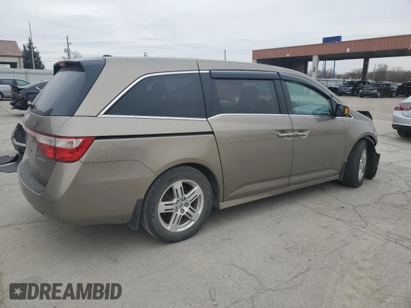 2012 Honda Odyssey Touring with VIN 5FNRL5H9XCB078399, listed as a Copart auction lot 52360165 with 174,819 mi miles and Salvage Title. Bid and sale history available at DreamBid. Image 3.