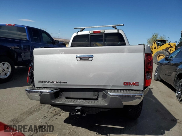 2010 GMC Canyon z VIN 1GTJTFDP2A8135909, wystawiony jako Copart lot #48905005 z przebiegiem Nie podano mil oraz Szkoda całkowita • Salvage title. Historia ofert i sprzedaży dostępna na DreamBid. Obrazek 6.