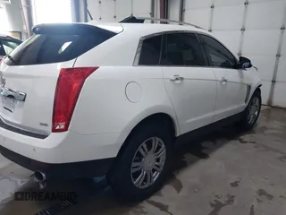 2014 Cadillac SRX Performance Collection with VIN 3GYFNFE36ES615440, listed as a IAAI auction lot 41830849 with 125,128 mi miles and . Bid and sale history available at DreamBid. Image 4.