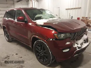 2018 Jeep Grand Cherokee Laredo E with VIN 1C4RJFAG9JC436803, listed as a IAAI auction lot 41572437 with 106,941 mi miles. Bid and sale history available at carsss.com. Image 1.