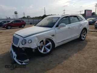 2019 Bentley Bentayga V8 z VIN SJAAM2ZV4KC025246, wystawiony jako Copart lot #88336735 z przebiegiem Nie podano mil oraz Szkody całkowita. Historia ofert i sprzedaży dostępna na DreamBid. Obrazek 1.