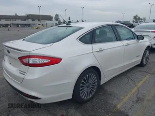 2013 Ford Fusion Titanium Hybrid with VIN 3FA6P0RUXDR386675, listed as a IAAI auction lot 42013986 with 89,349 mi miles. Bid and sale history available at carsss.com. Image 4.
