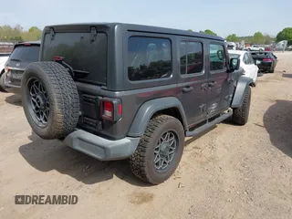 2019 Jeep Wrangler Unlimited Sport S with VIN 1C4HJXDG2KW516571, listed as a IAAI auction lot 42043223 with 58,131 mi miles and . Bid and sale history available at DreamBid. Image 4.