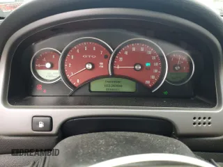 2004 Pontiac GTO z VIN 6G2VX12G04L206500, wystawiony jako Copart lot #55048785 z przebiegiem 102 254 mil mil oraz Szkody całkowita. Historia ofert i sprzedaży dostępna na DreamBid. Obrazek 9.