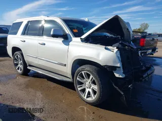 2015 Cadillac Escalade Luxury z VIN 1GYS3MKJXFR651714, wystawiony jako IAAI lot #41205449 z przebiegiem 129 066 mil mil oraz . Historia ofert i sprzedaży dostępna na DreamBid. Obrazek 1.