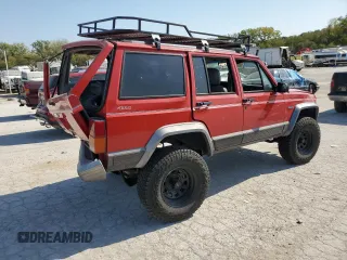 1996 Jeep Cherokee Country with VIN 1J4FJ78S9TL130605, listed as a Copart auction lot 74673934 with 196,857 mi miles and Salvage Title. Bid and sale history available at carsss.com. Image 3.