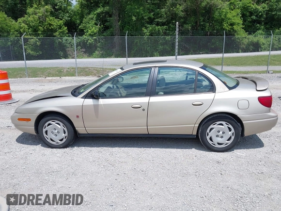 2001 Saturn SL z VIN 1G8ZK54721Z272773, wystawiony jako IAAI lot #42449133 z przebiegiem 56 714 mil mil oraz . Historia ofert i sprzedaży dostępna na DreamBid. Obrazek 14.