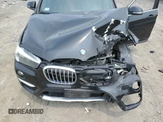 2018 BMW X1 xDrive28i with VIN WBXHT3C36J3H29952, listed as a Copart auction lot 59679285 with 75,220 mi miles and Salvage title. Bid and sale history available at DreamBid. Image 12.