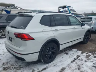 2023 Volkswagen Tiguan SE R-Line Black with VIN 3VVCB7AX6PM132085, listed as a IAAI auction lot 41278065 with 24,333 mi miles. Bid and sale history available at carsss.com. Image 4.