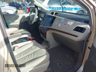 2011 Toyota Sienna XLE AAS with VIN 5TDYK3DCXBS117023, listed as a IAAI auction lot 41581785 with 216,341 mi miles. Bid and sale history available at carsss.com. Image 5.