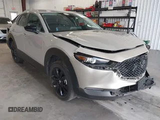 2024 Mazda CX-30 S Select Sport with VIN 3MVDMBBM0RM698491, listed as a IAAI auction lot 42609161 with 21,576 mi miles and . Bid and sale history available at DreamBid. Image 1.