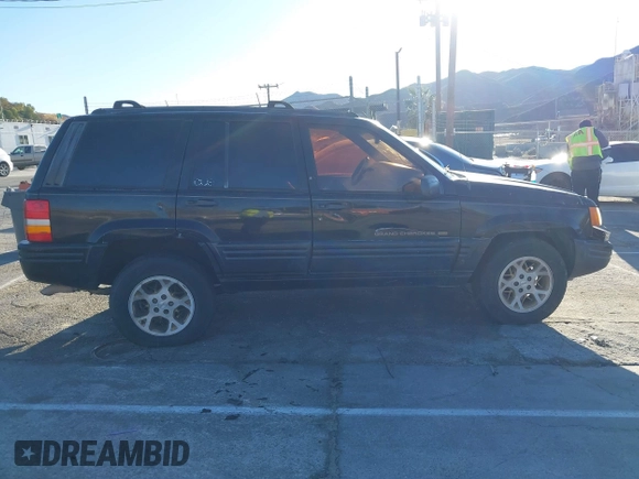 1998 Jeep Grand Cherokee Limited with VIN 1J4GX78Y8WC110325, listed as a IAAI auction lot 41357373 with 165,106 mi miles. Bid and sale history available at carsss.com. Image 13.