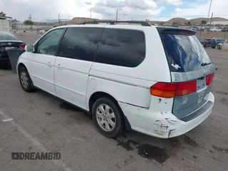 2001 Honda Odyssey EX z VIN 2HKRL18661H566973, wystawiony jako IAAI lot #42117015 z przebiegiem 206 999 mil mil oraz . Historia ofert i sprzedaży dostępna na DreamBid. Obrazek 3.