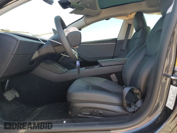 2025 Tesla Model 3 Long Range with VIN 5YJ3E1EA1SF878806, listed as a Copart auction lot 50427005 with 9,790 mi miles and Salvage Title. Bid and sale history available at DreamBid. Image 7.