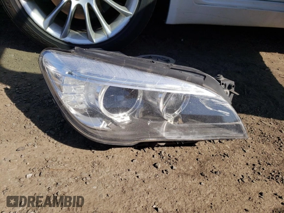2014 BMW 7 Series 740Li xDrive with VIN WBAYF4C50ED281830, listed as a Copart auction lot 48557035 with 129,497 mi miles and Salvage Title. Bid and sale history available at carsss.com. Image 12.