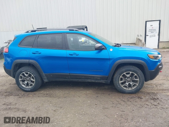 2021 Jeep Cherokee Trailhawk with VIN 1C4PJMBXXMD173102, listed as a IAAI auction lot 42205402 with 57,321 mi miles and . Bid and sale history available at DreamBid. Image 14.