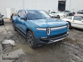 2023 Rivian R1T Adventure with VIN 7FCTGBAA5PN026063, listed as a Copart auction lot 66916194 with 0 mi miles and Salvage Title. Bid and sale history available at carsss.com. Image 4.