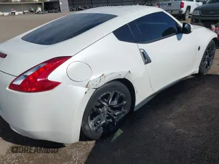 2016 Nissan 370Z Sport z VIN JN1AZ4EH9GM931683, wystawiony jako IAAI lot #42000779 z przebiegiem 113 919 mil mil oraz . Historia ofert i sprzedaży dostępna na DreamBid. Obrazek 6.