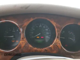 1999 Jaguar XJ z VIN SAJKX6048XC849376, wystawiony jako Copart lot #70538064 z przebiegiem 122 891 mil mil oraz Szkoda całkowita • Salvage title. Historia ofert i sprzedaży dostępna na DreamBid. Obrazek 9.