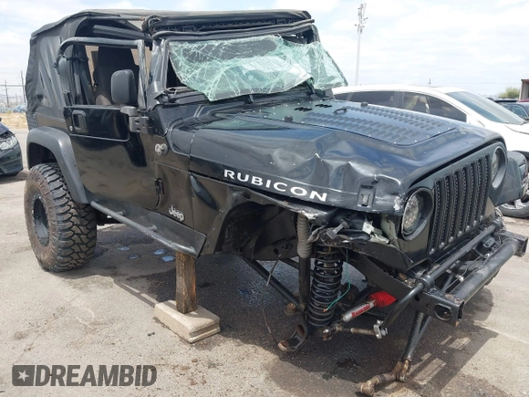 2004 Jeep Wrangler Rubicon z VIN 1J4FA69S84P727716, wystawiony jako IAAI lot #42162129 z przebiegiem 90 844 mil mil oraz . Historia ofert i sprzedaży dostępna na DreamBid. Obrazek 6.