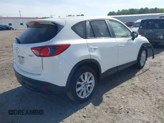 2015 Mazda CX-5 Grand Touring with VIN JM3KE2DY5F0498718, listed as a IAAI auction lot 42070000 with 129,327 mi miles. Bid and sale history available at carsss.com. Image 4.