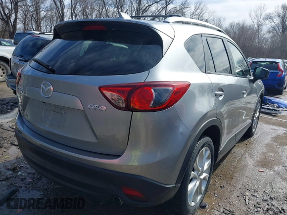 2014 Mazda CX-5 Grand Touring with VIN JM3KE2DY8E0375025, listed as a IAAI auction lot 41657755 with 103,601 mi miles. Bid and sale history available at carsss.com. Image 4.