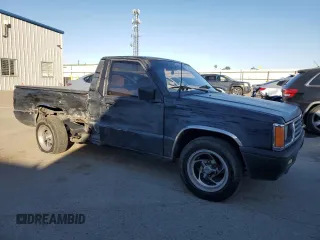 1994 Mitsubishi Mighty Max z VIN JA7LS21G6RP012556, wystawiony jako Copart lot #44242825 z przebiegiem 213 338 mil mil oraz Szkody całkowita. Historia ofert i sprzedaży dostępna na DreamBid. Obrazek 4.