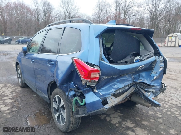 2018 Subaru Forester Limited with VIN JF2SJAJC4JH525104, listed as a IAAI auction lot 42018479 with 97,843 mi miles. Bid and sale history available at carsss.com. Image 3.