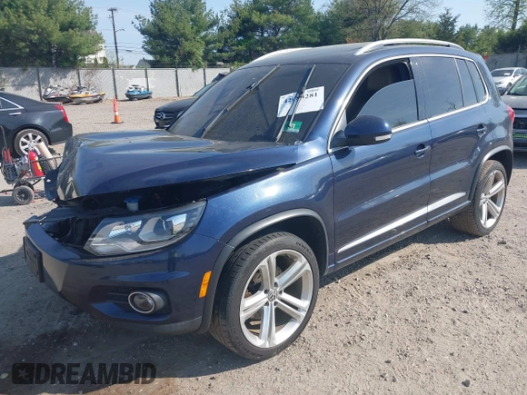 2014 Volkswagen Tiguan S z VIN WVGBV3AX7EW545538, wystawiony jako IAAI lot #42083281 z przebiegiem 129 227 mil mil oraz . Historia ofert i sprzedaży dostępna na DreamBid. Obrazek 2.