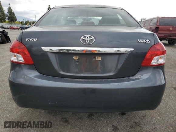 2009 Toyota Yaris with VIN JTDBT903291324461, listed as a Copart auction lot 54769875 with 141,777 mi miles and Salvage Title. Bid and sale history available at DreamBid. Image 6.